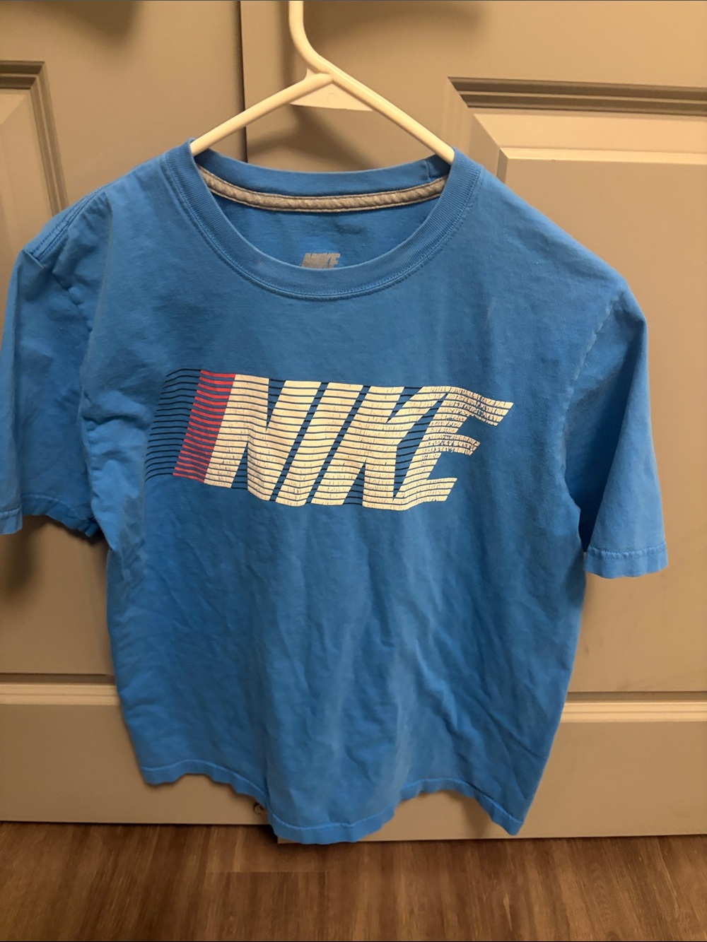 Nike Light Blue Tee with Striped White & Red Logo